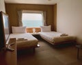 Bedroom with interior of double passenger cabin ferry ship with ocean view. Royalty Free Stock Photo