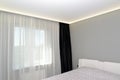Bedroom interior fragment with a black portiere Royalty Free Stock Photo