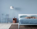 Bedroom interior in light blue with a minimalist bed Royalty Free Stock Photo