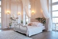 The interior of a beautiful bedroom Suite in bright white. Royalty Free Stock Photo