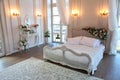 The interior of a beautiful bedroom Suite in bright white. Royalty Free Stock Photo