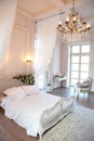 The interior of a beautiful bedroom Suite in bright white. Royalty Free Stock Photo