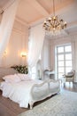 The interior of a beautiful bedroom Suite in bright white. Royalty Free Stock Photo