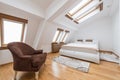 Bedroom interior in luxury loft, attic, apartment with roof wind Royalty Free Stock Photo