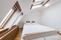 Bedroom interior in luxury loft, attic, apartment with roof wind