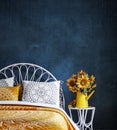 Bedroom interior with sunflowers decoration and grungy blue wall background