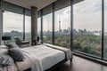 A bedroom with a large window overlooking a city Royalty Free Stock Photo