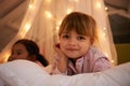 Bedroom, lights and portrait of children at night for resting, relaxing and dreaming in home. Happy, smile and face of Royalty Free Stock Photo