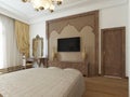 Bedroom in the Middle Eastern Arabian style with luxurious wooden carvings and a large bed with a wooden headboard.