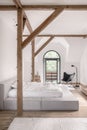 Stylish bedroom in modern style with wooden beams Royalty Free Stock Photo