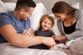 Bedroom, morning and family with parents, girl and bonding together with fun and tickle with happiness. Home, mother and