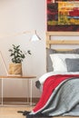 Bedroom with plant, lamp and painting Royalty Free Stock Photo