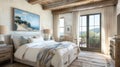 The bedroom is a tranquil oasis with its whitewashed walls and ceiling accented with wooden beams. The plush bed is