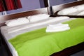 Bedroom with two towels on the bed Royalty Free Stock Photo