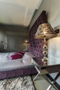 Bedroom with violet quilted bed