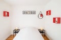 Bedroom with white bed with black bedside tables