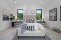 Bedroom with a white bed in a modern new construction home in Los Angeles Royalty Free Stock Photo