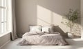 A bedroom with a white wall and a bed with a white comforter Royalty Free Stock Photo