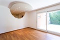 Bedroom with white walls and parquet. Arch with spotlights Royalty Free Stock Photo