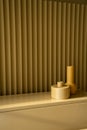 Bedroom working corner decorated yellow ceramic vase on mustard color corrugated wall in the background /apartment interior /copy
