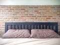 Bedrooms With Exposed Brick Walls Interior Design Ideas.  brick wall behind the bed in red .strong background for an industrial Royalty Free Stock Photo