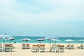 Beds and umbrella on a beach Royalty Free Stock Photo