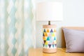 bedside lamp with colorful geometric pattern shade