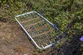 bedspring left in the midst of the weeds Royalty Free Stock Photo