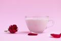Bedtime pink moon milk in a glass cup on pastel pink background Royalty Free Stock Photo