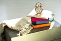 Bedtime reading, alarm clock and books Royalty Free Stock Photo