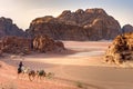 Beduin and camels in Wadi Rum desert in Jordan. Royalty Free Stock Photo