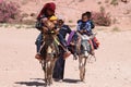 Petra, Jordan. May 9 2022. A family of Bedul Bedouins on 2 donkeys.