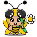 Bee animal mascot costume holding flowers Royalty Free Stock Photo