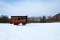 Bee hive in winter on a snowy meadow