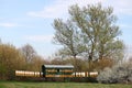 Bee hives on green field landscape