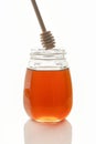 Bee honey with a wooden spoon for honey.