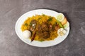 Beef Bhuna Khichuri, biryani, pulao, rice with boiled egg and salad served in dish isolated on background top view of bangladesh