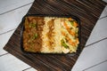 Beef Bhuna with pulao biryani rice with cucumber, dip sauce and lemon slice served in dish isolated on wooden table top view of Royalty Free Stock Photo