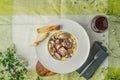 Beef bourguignon in a ceramic plate on a tablecloth and white fl Royalty Free Stock Photo