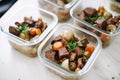 beef bourguignon meal prepped in individual containers