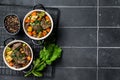 Beef bourguignon meat stew with vegetables, mushrooms and red wine in a pot. Black background. Top view. Copy space Royalty Free Stock Photo