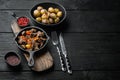 Beef bourguignon stew with vegetables, in cast iron frying pan, on black wooden background, with copy space for text Royalty Free Stock Photo