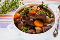 Beef Bourguignon in a white soup bowl. Stew with carrots, onions, mushrooms, bacon, garlic and bouquet garni. Royalty Free Stock Photo