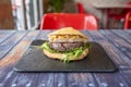 Beef burger with foie slice, stewed onion, arugula Royalty Free Stock Photo