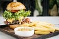 Beef burger with fries and mustard sauce set meal