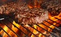 Beef burger for hamburger on barbecue flame grill Royalty Free Stock Photo