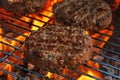 Beef burger for hamburger on barbecue flame grill Royalty Free Stock Photo