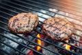 beef burger meat cooking on charcoal grill