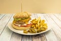 Beef burger with a Mexican twist, raw white onion, chopped spicy jalapeÃÂ±os, guacamole on top, melted cheddar cheese Royalty Free Stock Photo