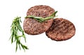 Beef burger patty cutlet for hamburger grilled on BBQ on marble board with rosemary. Isolated, white background.